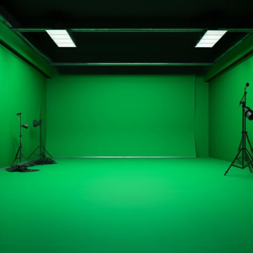 Green Screen Room with Lighting Fixtures and Camera Equipment