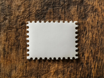 Blank Postage Stamp on Wooden Surface Sketches thumbnail