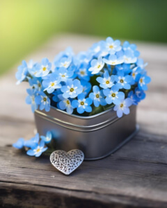 Flores Azuis Esquecidas em Recipiente de Metal em Forma de Coração thumbnail